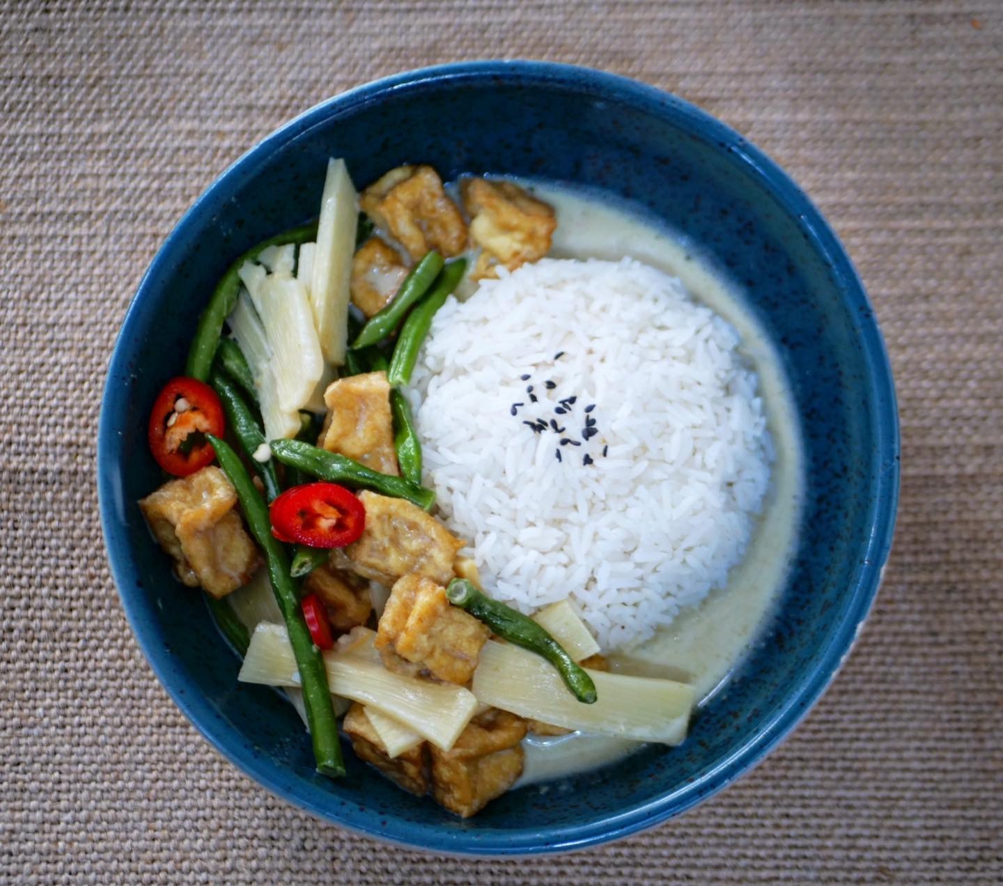 Thai green curry with tofu, rice, beans and bamboo shoots